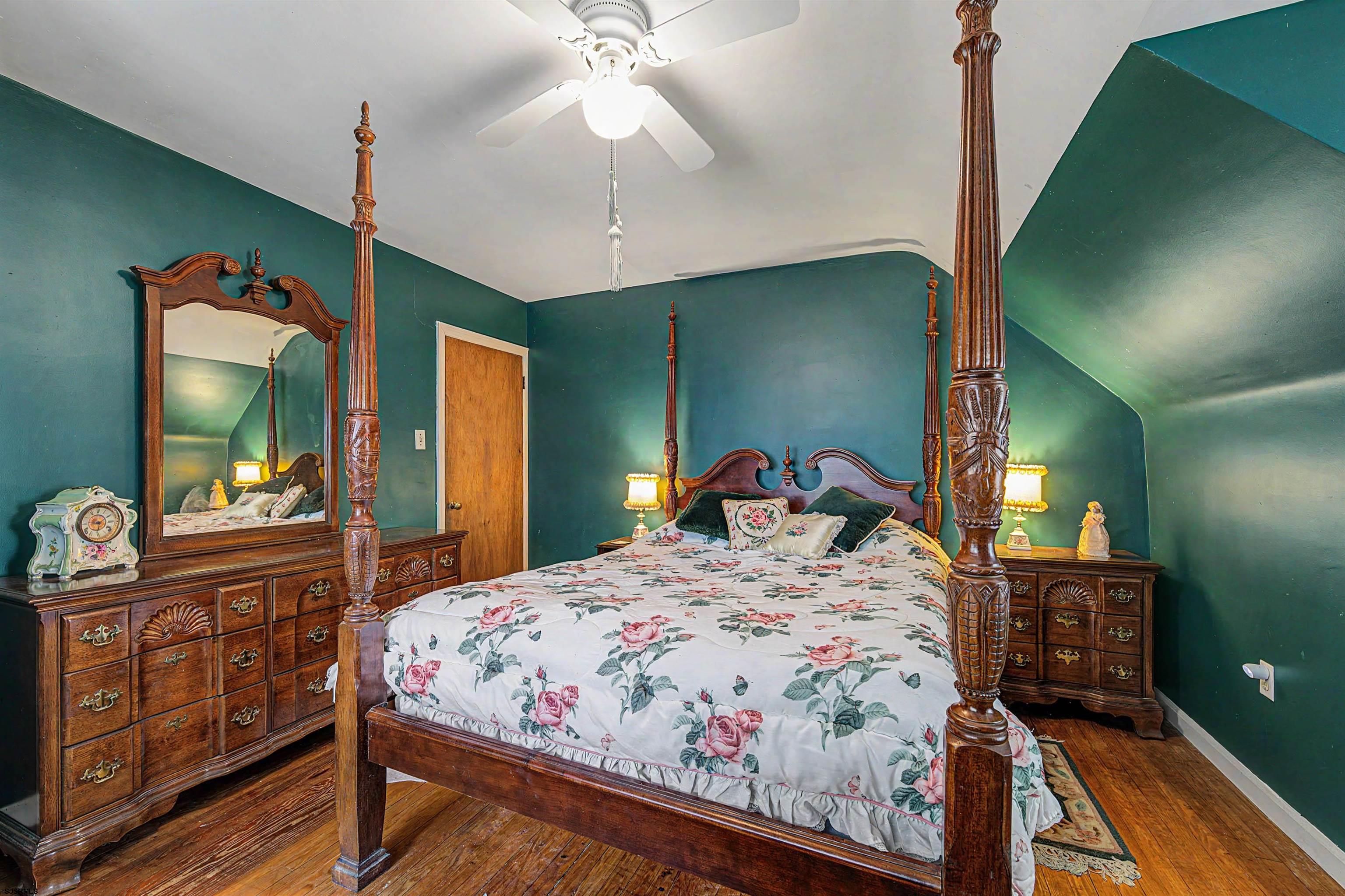 144 Pitney Road Absecon, NJ 08201 - Photo 26 of 47 a bedroom with a bed and dresser with mirror