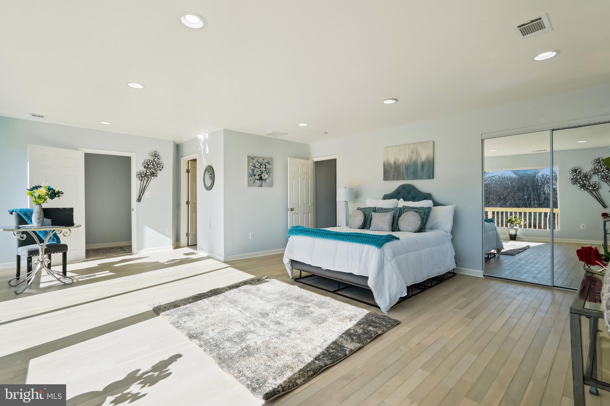 2528 Elvans Road Southeast Washington, DC 20020 - Photo 11 of 31 a bedroom with a bed and a large mirror