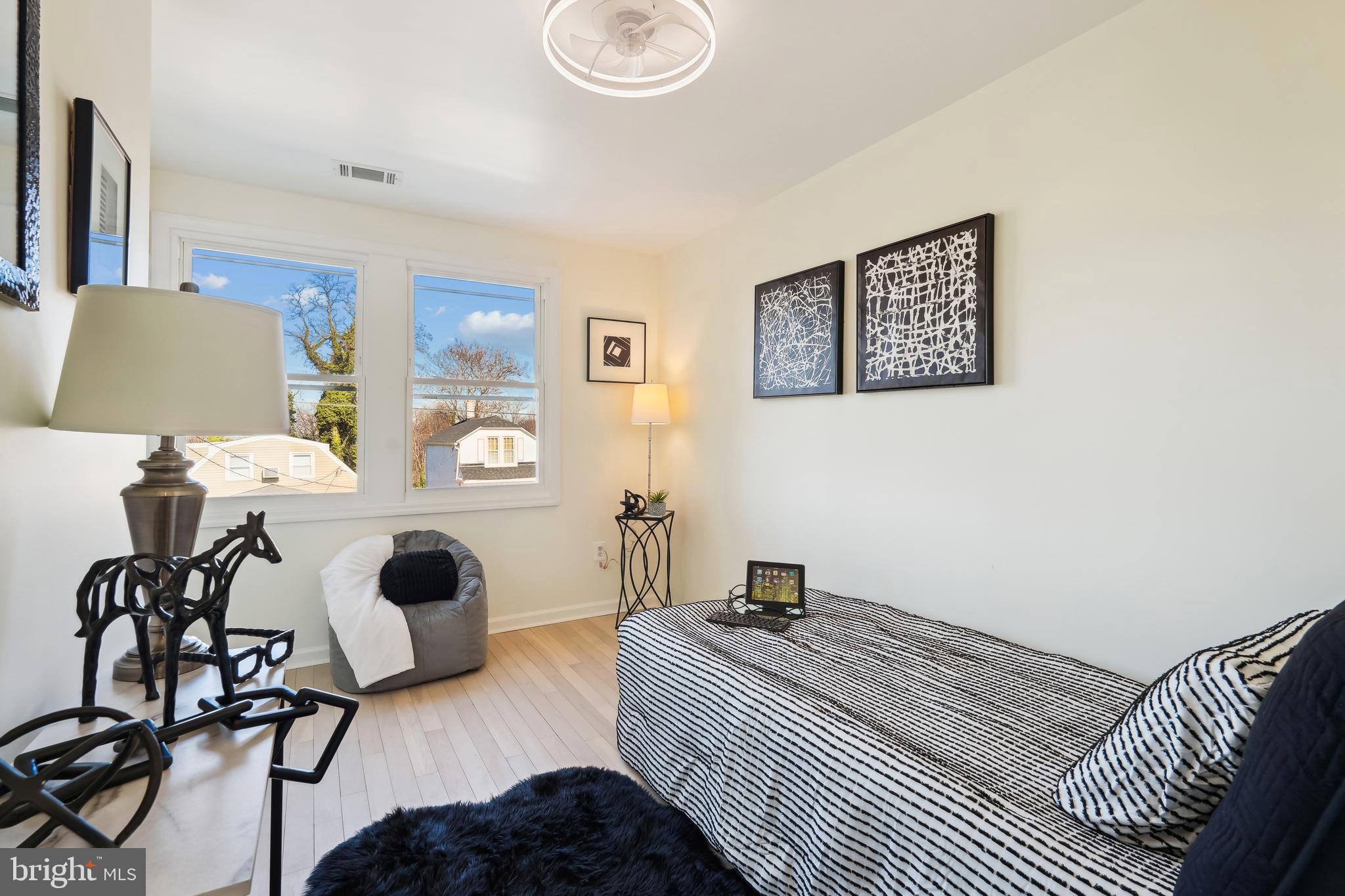 2528 Elvans Road Southeast Washington, DC 20020 - Photo 14 of 31 a bedroom with a bed and wooden floor