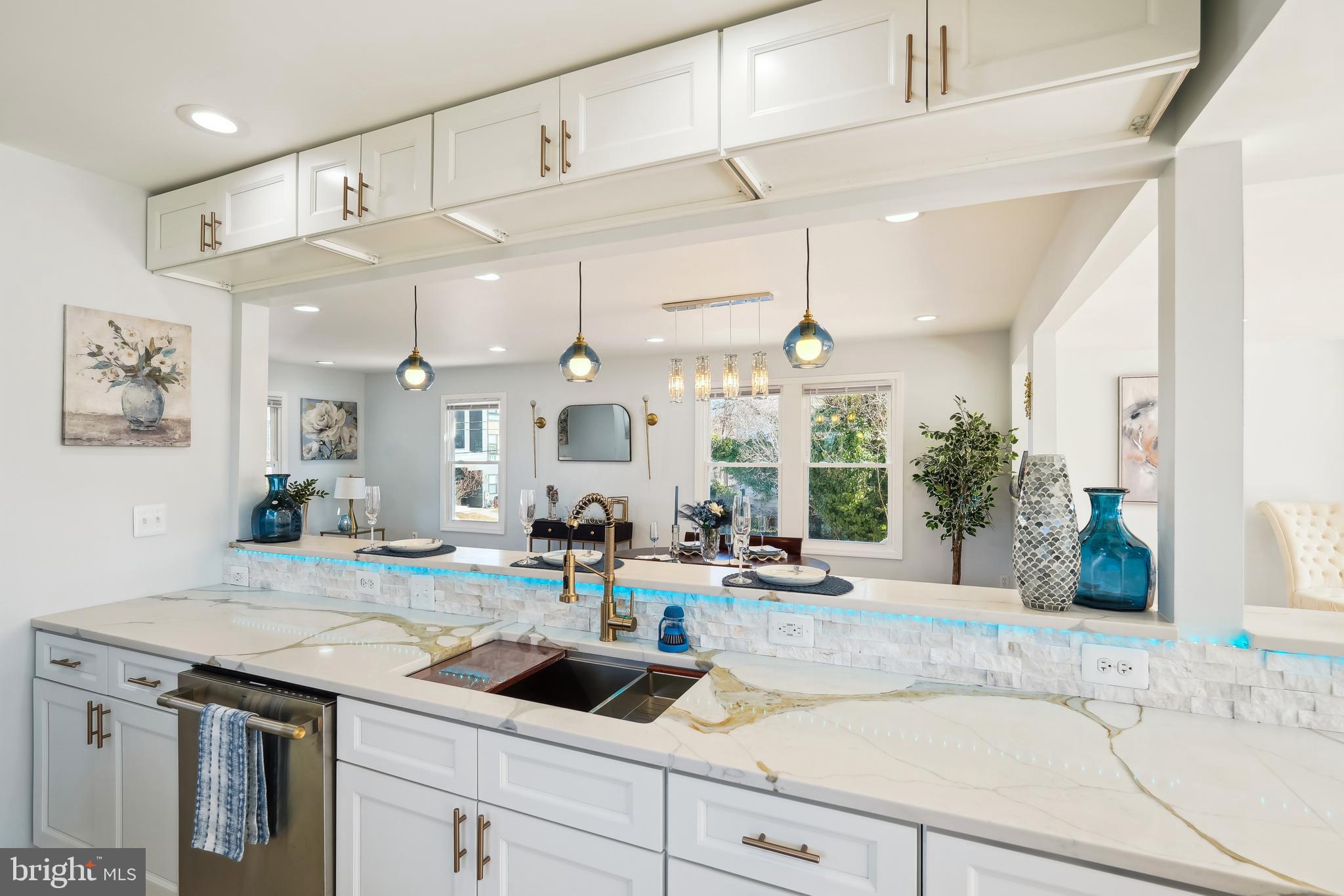 2528 Elvans Road Southeast Washington, DC 20020 - Photo 4 of 31 a kitchen with a sink dishwasher and a stove with wooden floor