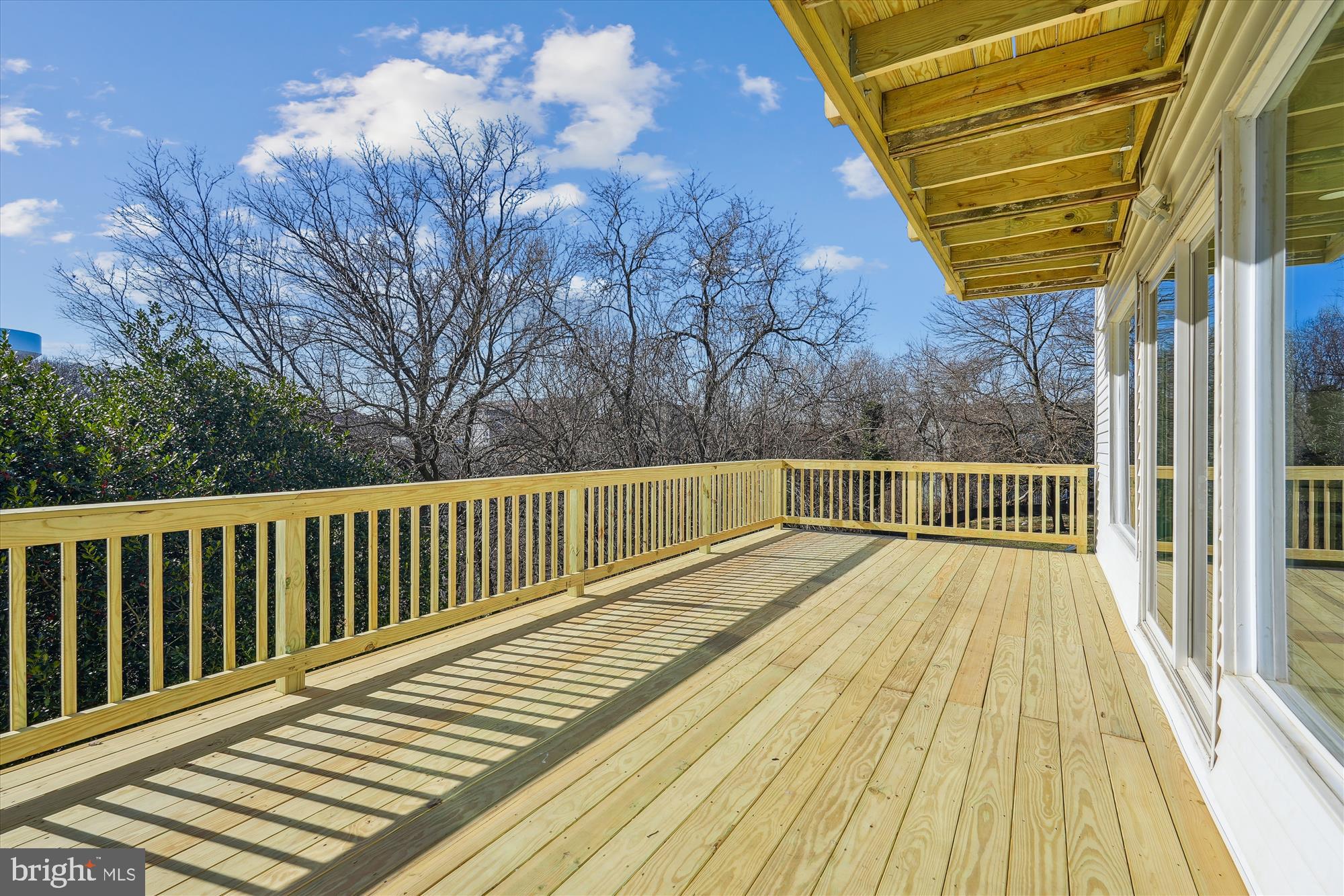 2528 Elvans Road Southeast Washington, DC 20020 - Photo 6 of 31 a view of balcony with wooden floor and fence