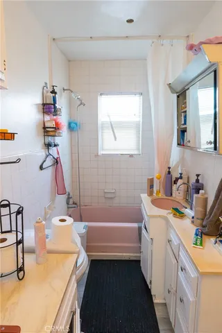 a bedroom with bed and window