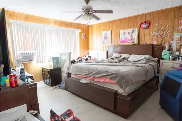 a bed room with a bed and a chandelier