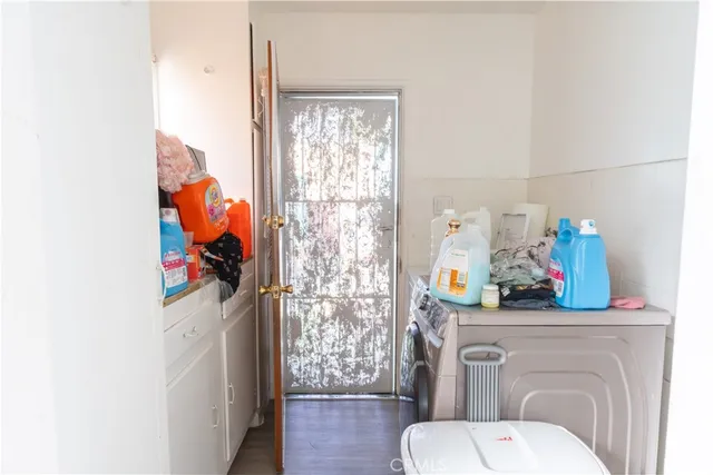 a aerial view of a house with a yard and potted plants