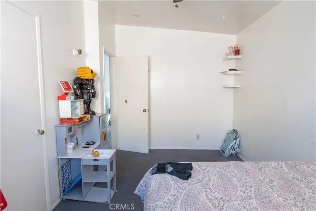 a bathroom with a sink toilet and shower curtain