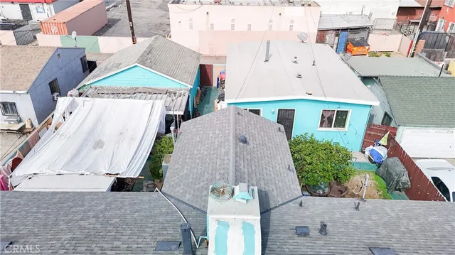 a view of a backyard with sitting area