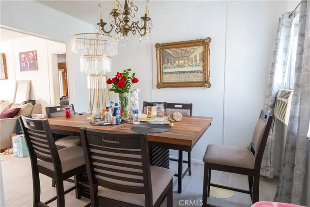 a living room with furniture a window and a flat screen tv