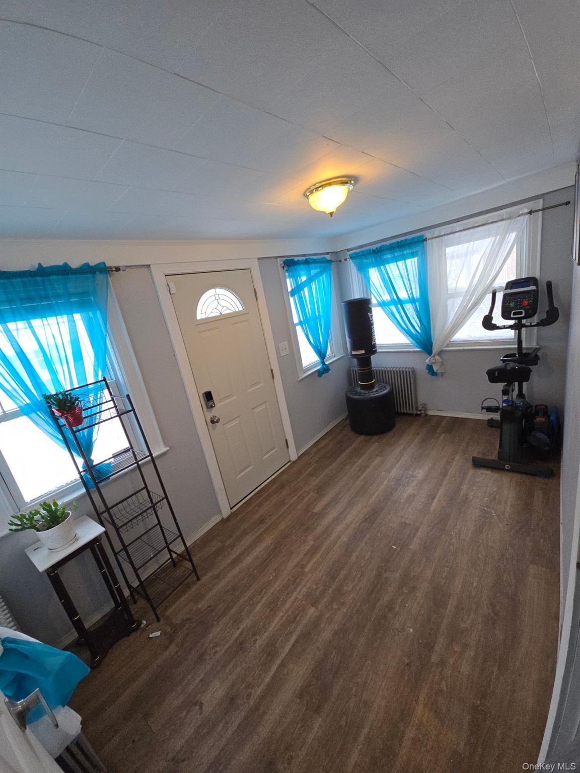4425 Edson Avenue Bronx, NY 10466 - Photo 8 of 21 a view of a livingroom with furniture staircase ceiling fan and window