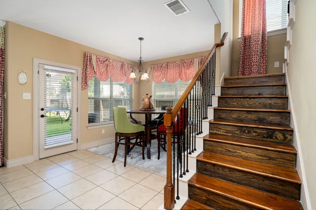 a view of entryway and hall with dining room