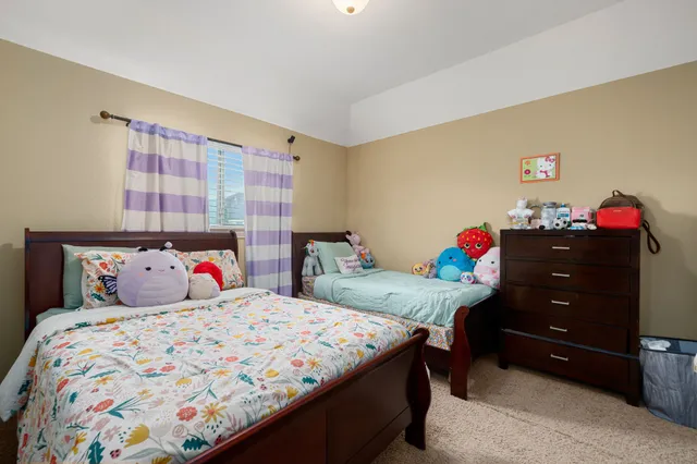 a bedroom with a bed and cabinets