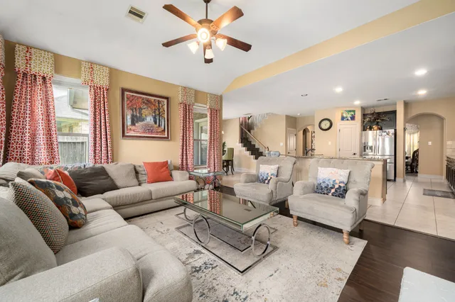 a living room with furniture and a large window