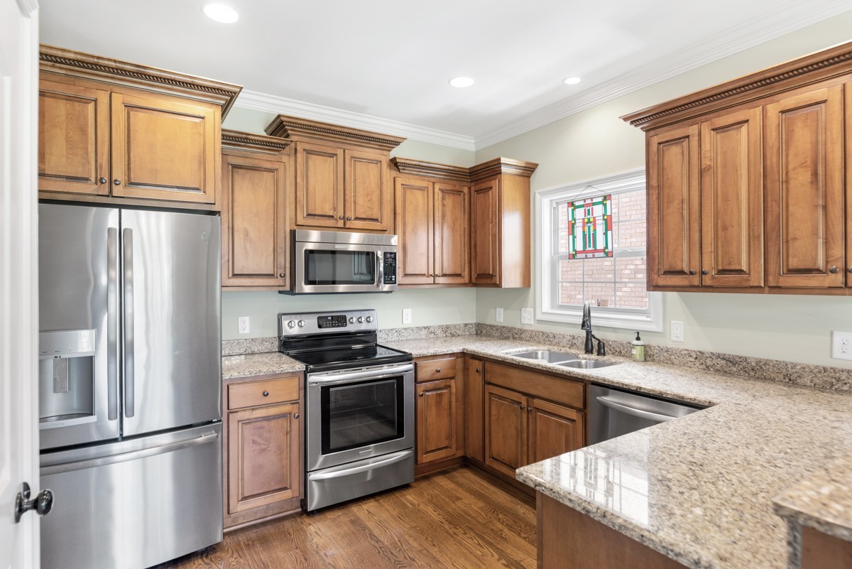 2011 Stonebrook Circle Mount Juliet, TN 37122 - Photo 12 of 39 a kitchen with stainless steel appliances granite countertop a refrigerator sink and stove