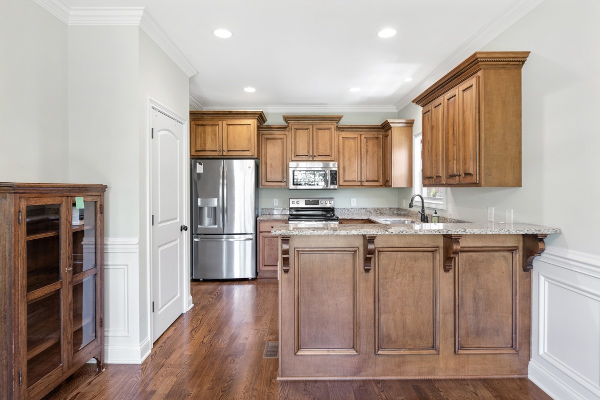 2011 Stonebrook Circle Mount Juliet, TN 37122 - Photo 14 of 39 a kitchen with stainless steel appliances granite countertop a refrigerator and a stove top oven