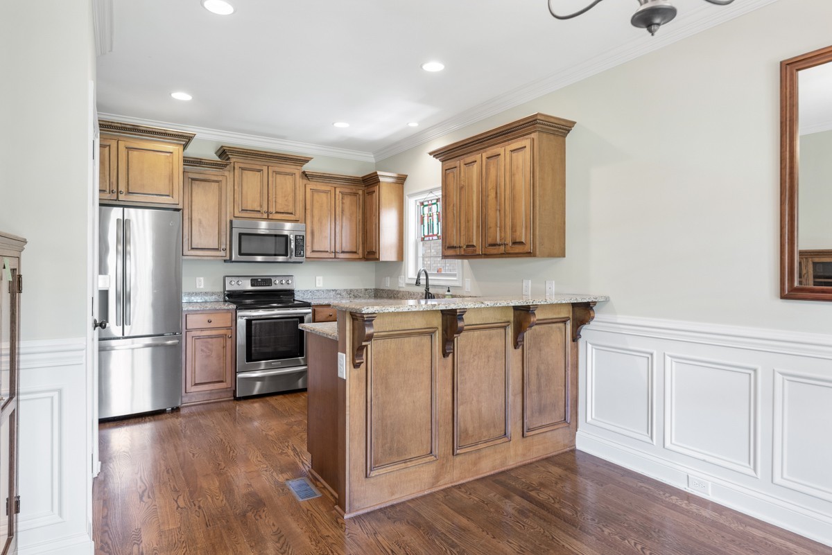 2011 Stonebrook Circle Mount Juliet, TN 37122 - Photo 15 of 39 a kitchen with granite countertop white cabinets and stainless steel appliances