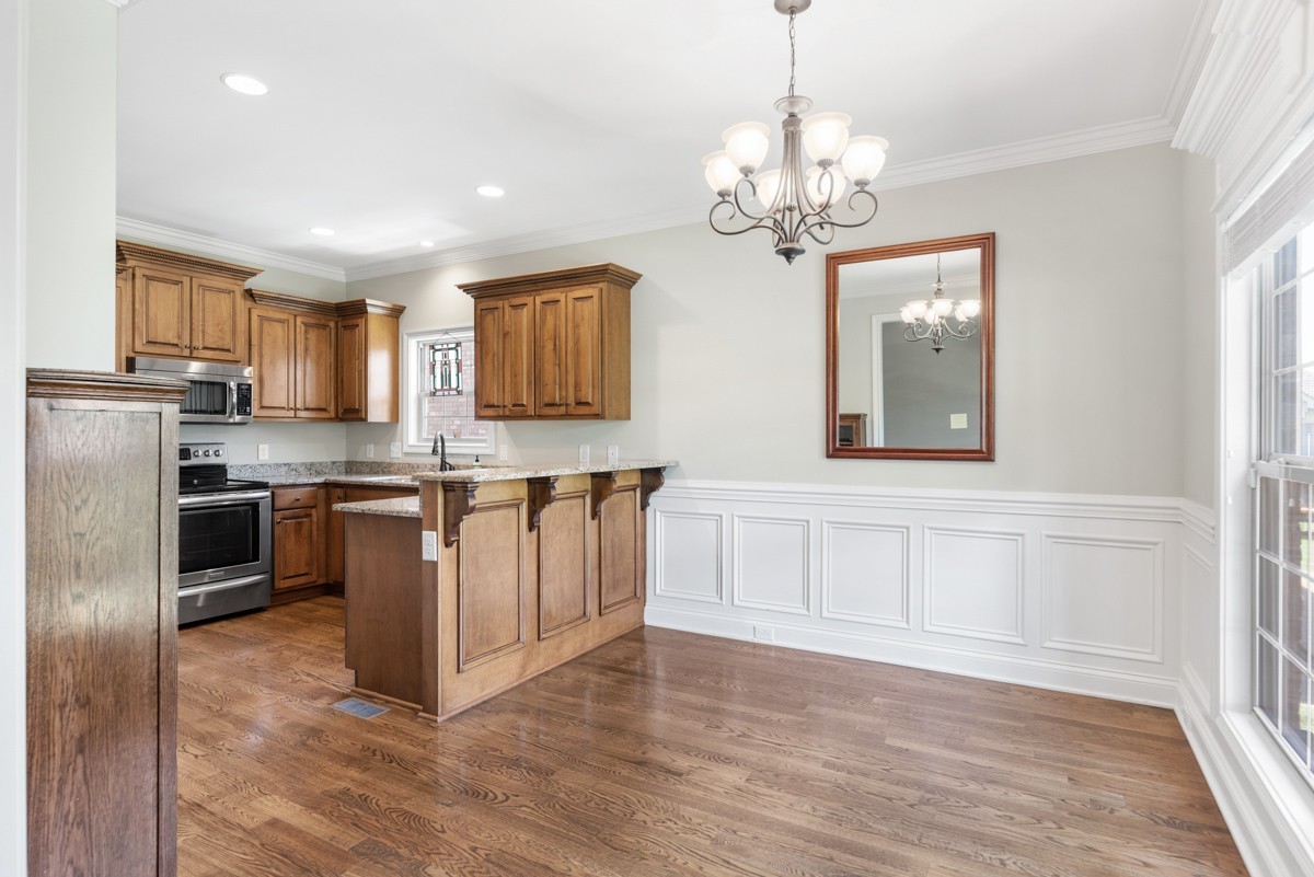 2011 Stonebrook Circle Mount Juliet, TN 37122 - Photo 16 of 39 a kitchen with stainless steel appliances granite countertop a refrigerator a stove a sink dishwasher a oven with white cabinets and wooden floor