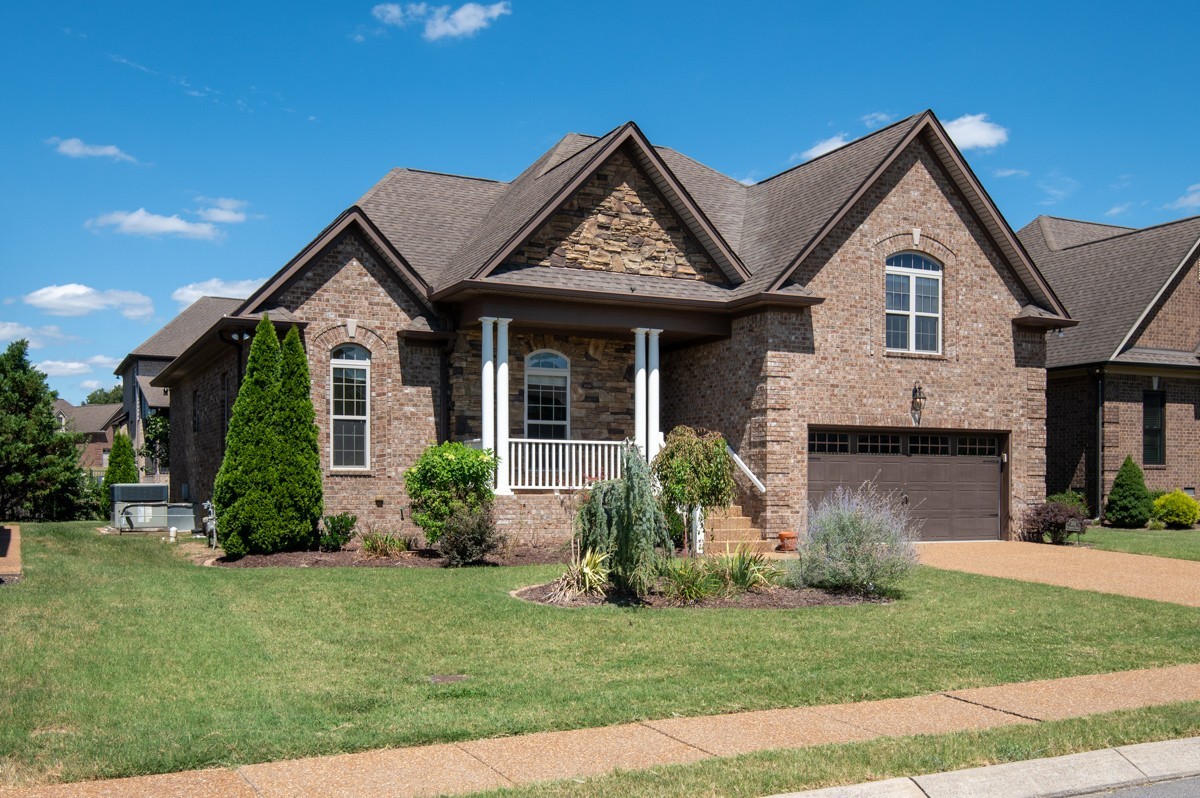 2011 Stonebrook Circle Mount Juliet, TN 37122 - Photo 2 of 39 a front view of a house with a yard and garage