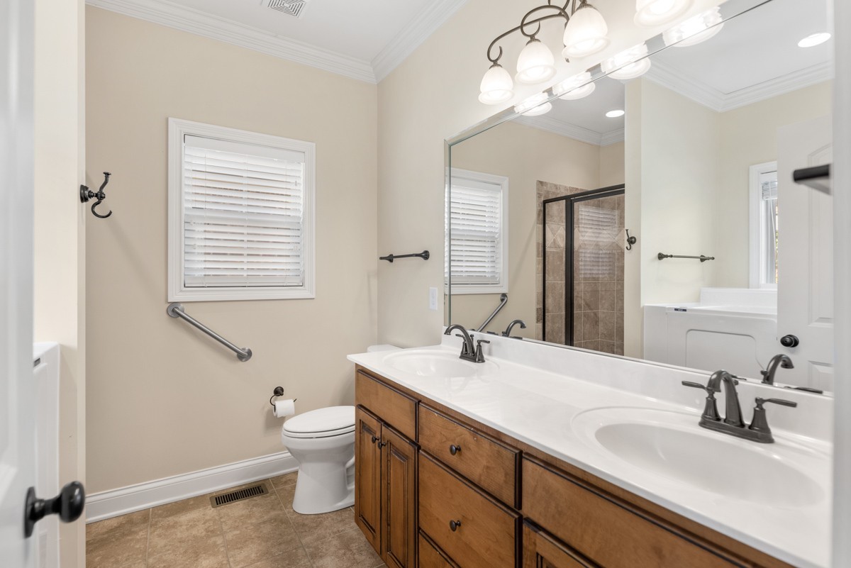 2011 Stonebrook Circle Mount Juliet, TN 37122 - Photo 21 of 39 a bathroom with a sink a toilet and a mirror