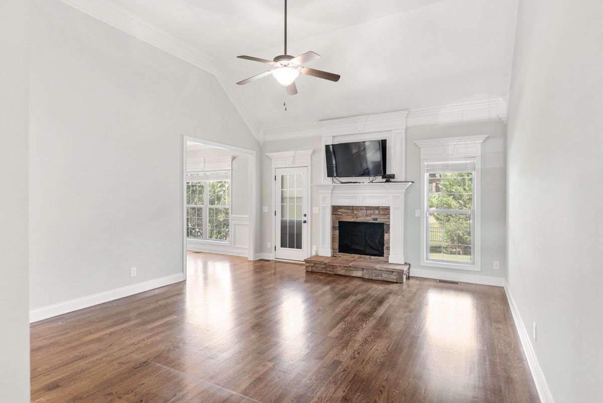2011 Stonebrook Circle Mount Juliet, TN 37122 - Photo 9 of 39 a view of an empty room with wooden floor fireplace and a window