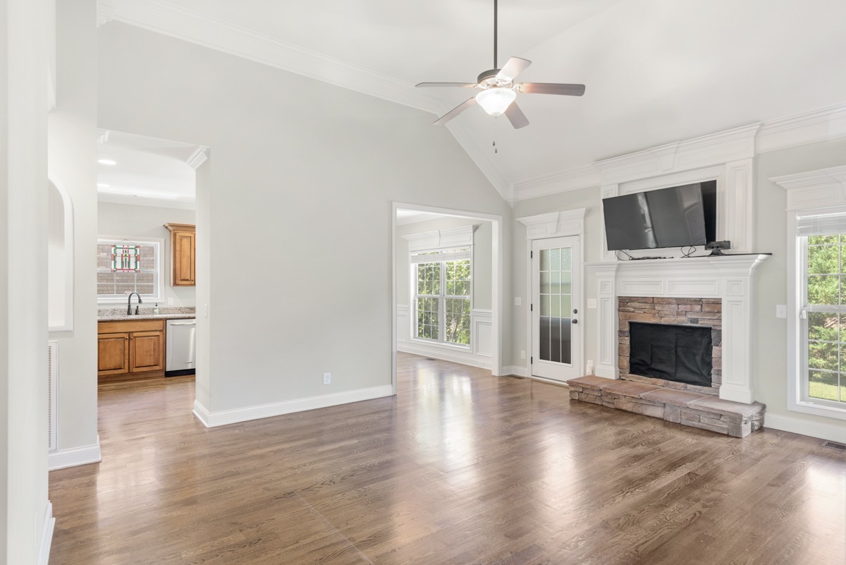 2011 Stonebrook Circle Mount Juliet, TN 37122 - Photo 10 of 39 a view of a livingroom with a fireplace wooden floor and a chandelier
