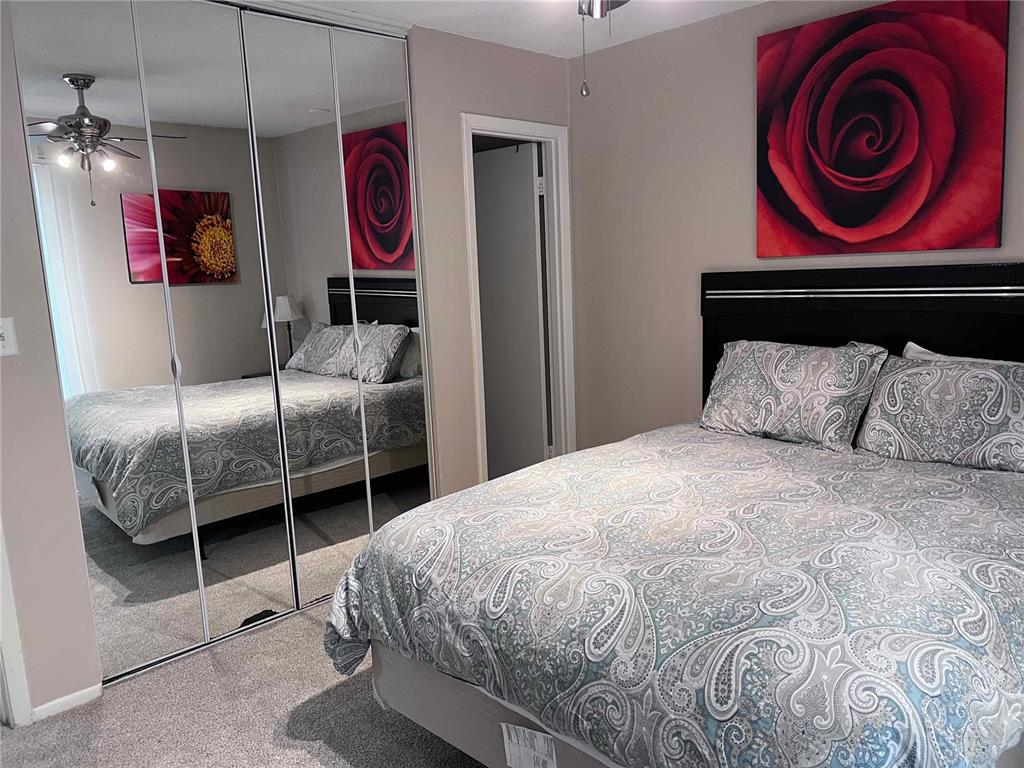 1700 Southwest 16th Court, Unit C26 Gainesville, FL 32608 - Photo 15 of 18 a bedroom with a bed and a closet