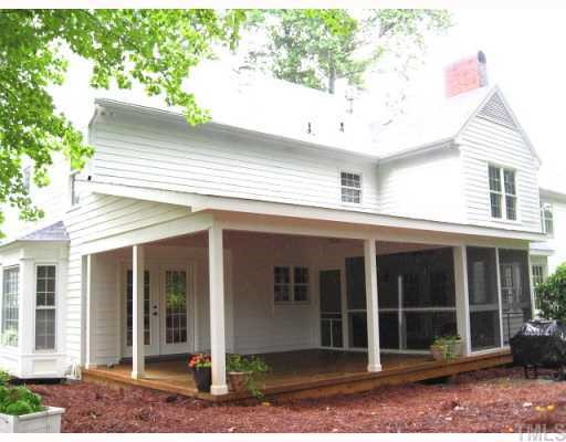 7116 Rainwater Road Raleigh, NC 27615 - Photo 11 of 12 View of back showing screened porch & covered porch