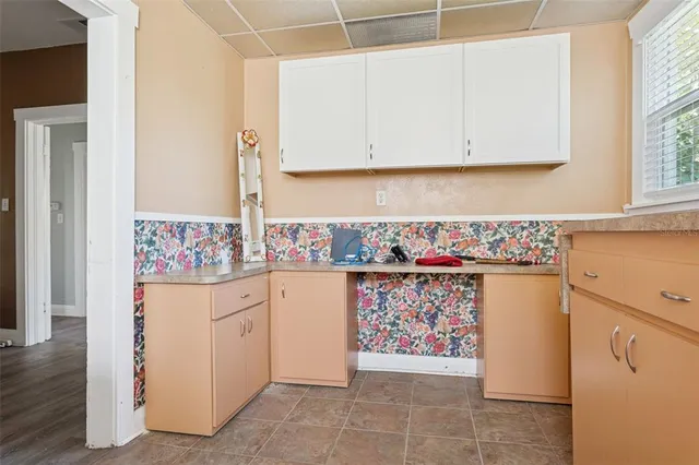 a kitchen with stainless steel appliances granite countertop a refrigerator and a stove