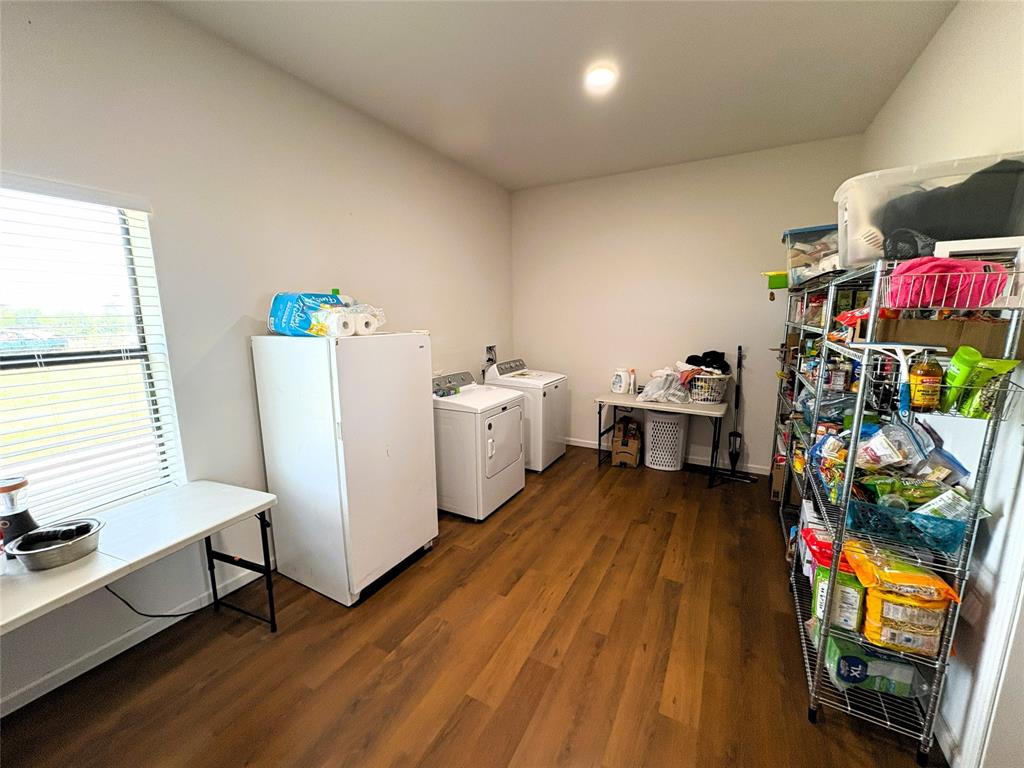4748 Battle Lake Road Mart, TX 76664 - Photo 17 of 33 Laundry area featuring dark wood-style flooring and separate washer and dryer