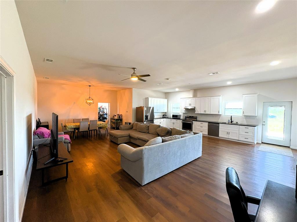 4748 Battle Lake Road Mart, TX 76664 - Photo 8 of 33 Living area featuring dark wood-style floors, a ceiling fan, and recessed lighting