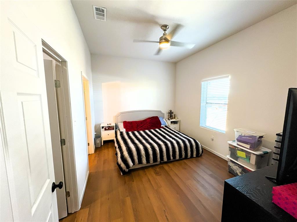 4748 Battle Lake Road Mart, TX 76664 - Photo 9 of 33 Bedroom with wood finished floors, baseboards, and ceiling fan