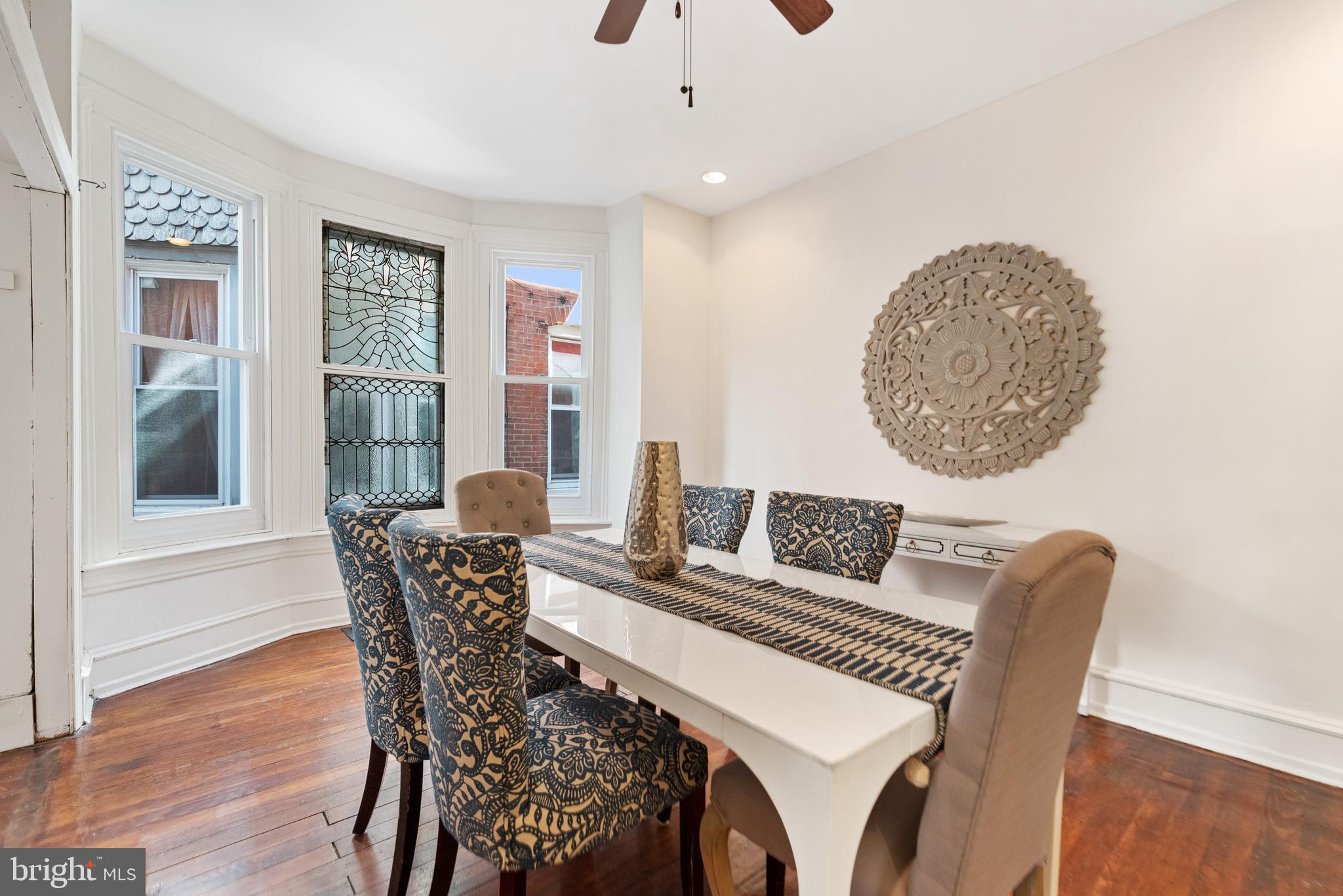 4710 Kingsessing Avenue Philadelphia, PA 19143 - Photo 11 of 30 a dining room with furniture and window