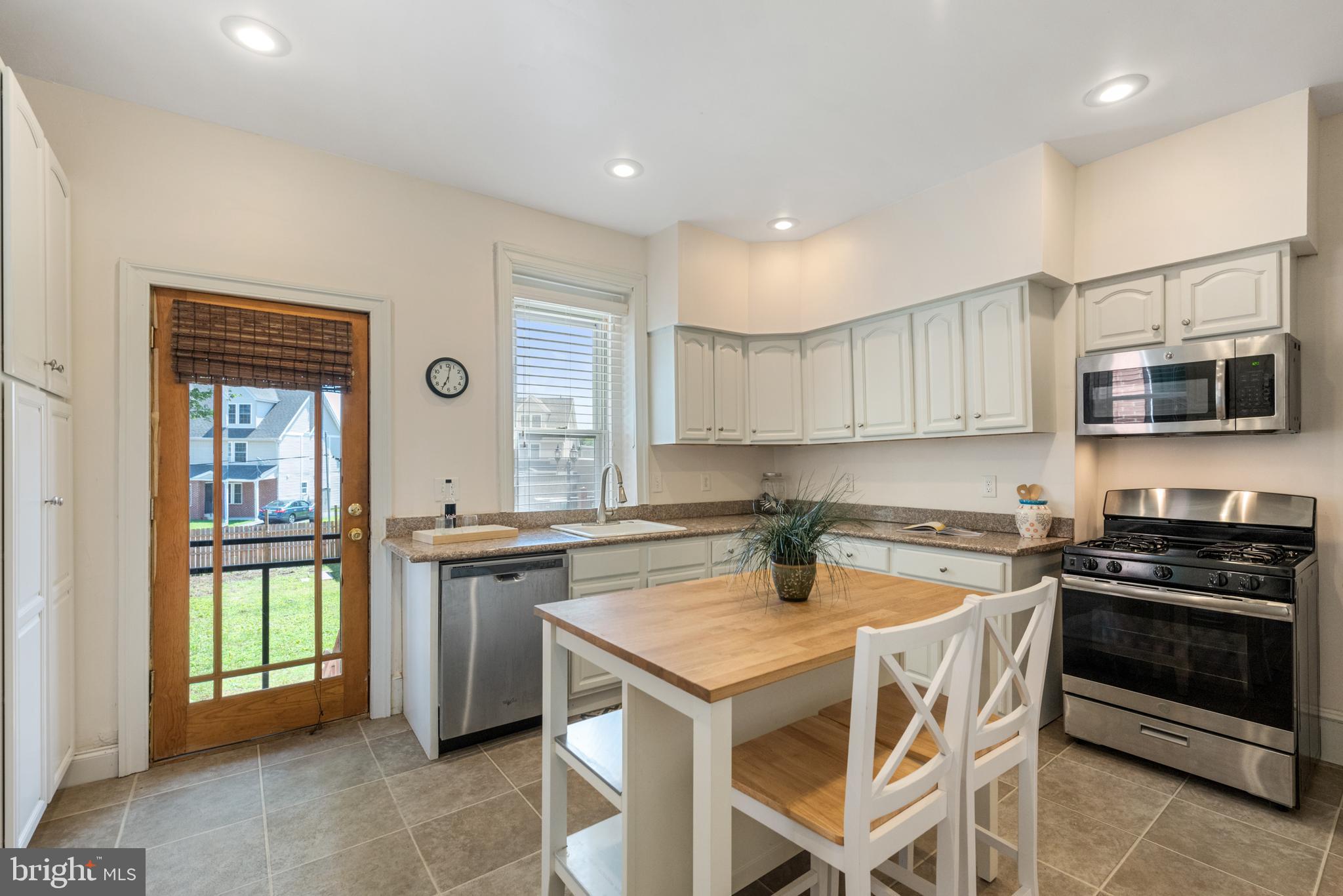 4710 Kingsessing Avenue Philadelphia, PA 19143 - Photo 14 of 30 a kitchen with a stove a sink and a microwave
