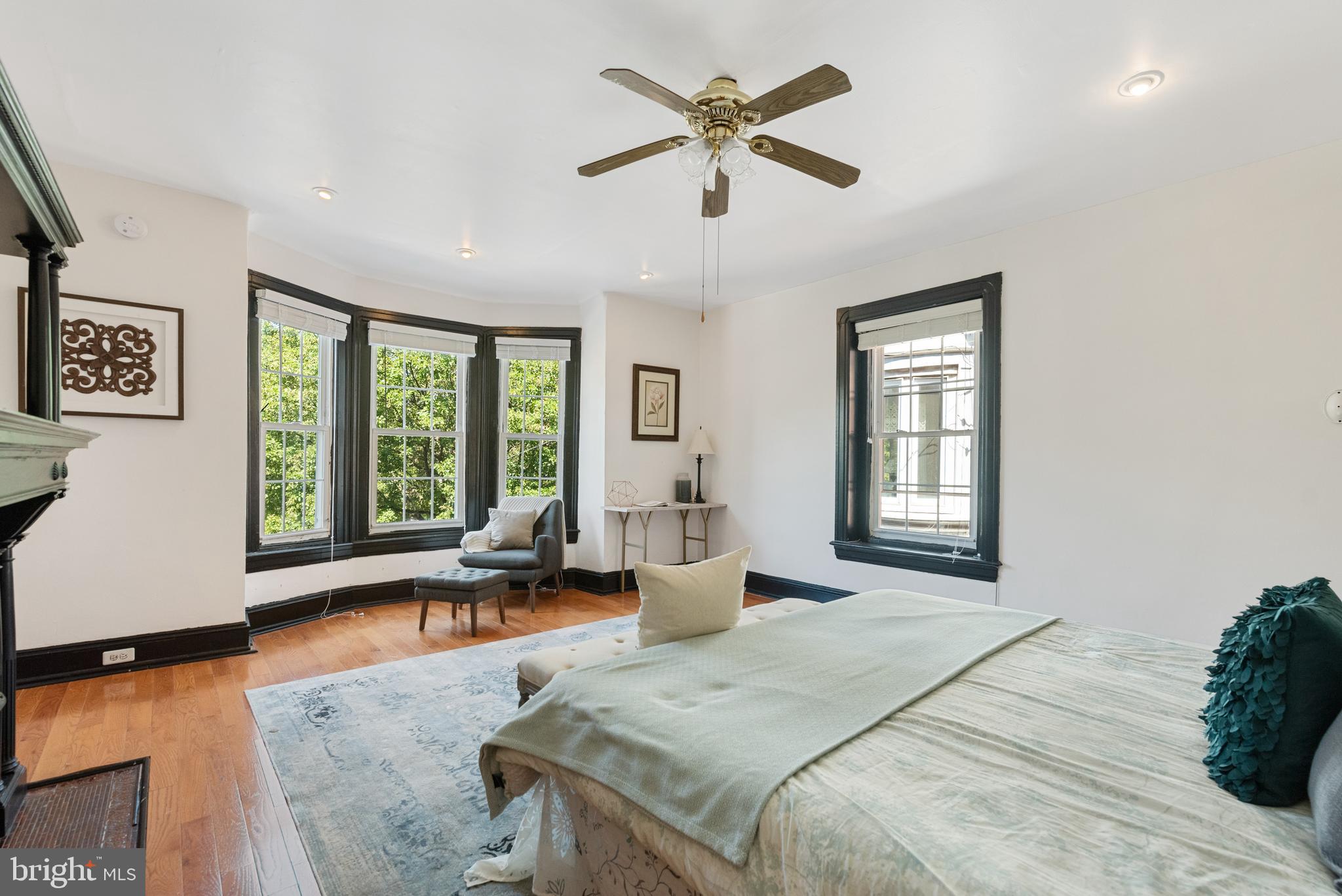 4710 Kingsessing Avenue Philadelphia, PA 19143 - Photo 19 of 30 a spacious bedroom with a large bed and a large window