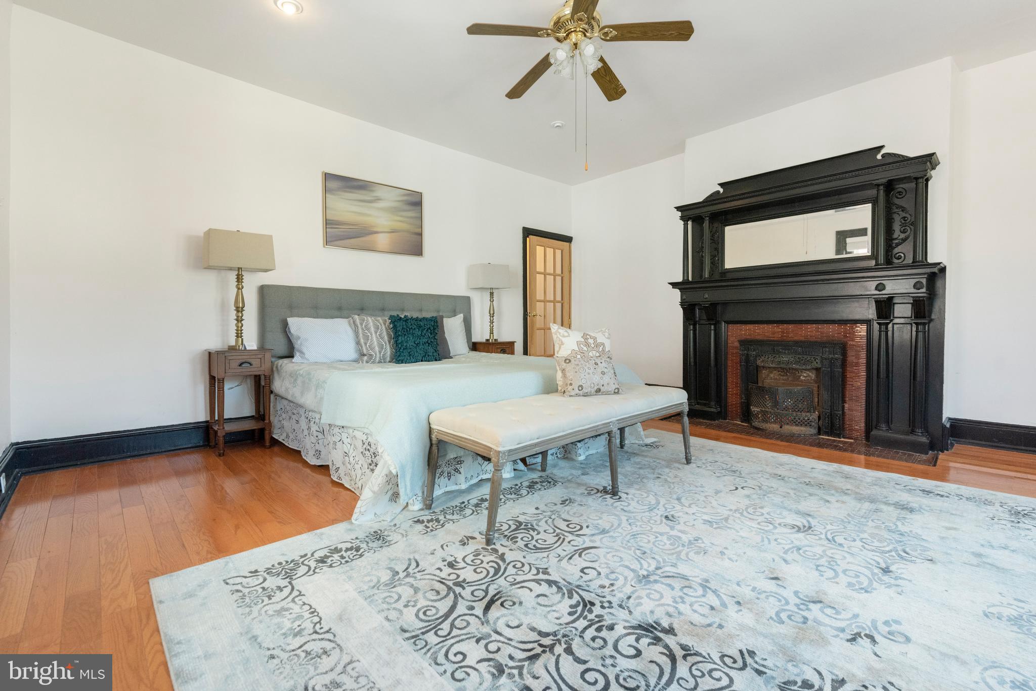 4710 Kingsessing Avenue Philadelphia, PA 19143 - Photo 20 of 30 a living room with furniture flat screen tv and a fireplace