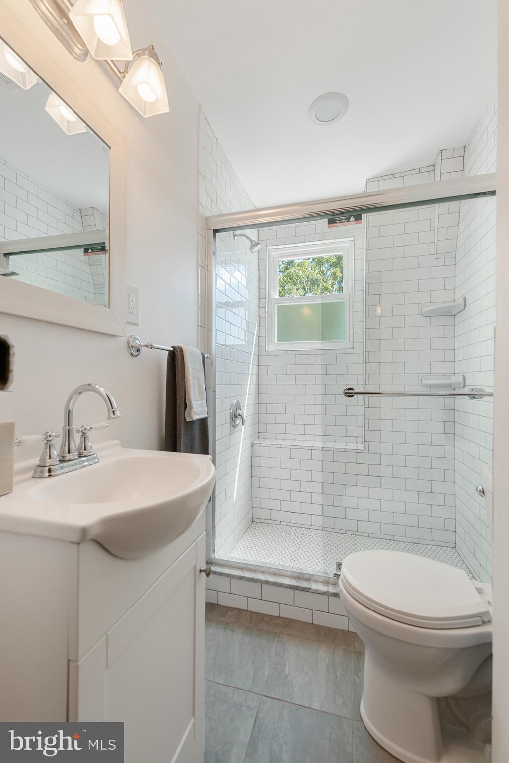 4710 Kingsessing Avenue Philadelphia, PA 19143 - Photo 30 of 30 a bathroom with a sink a toilet and shower