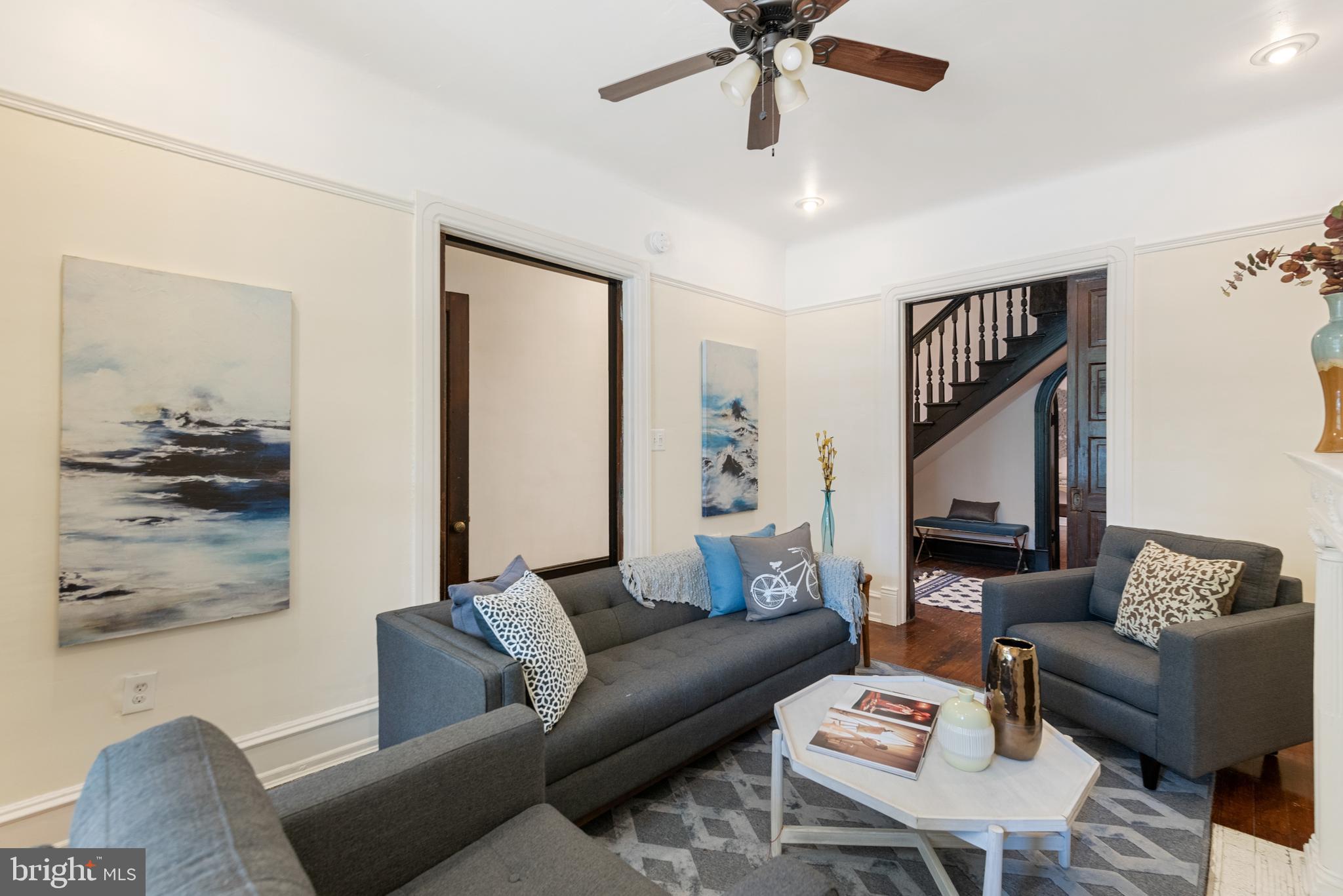 4710 Kingsessing Avenue Philadelphia, PA 19143 - Photo 5 of 30 a living room with furniture and a flat screen tv
