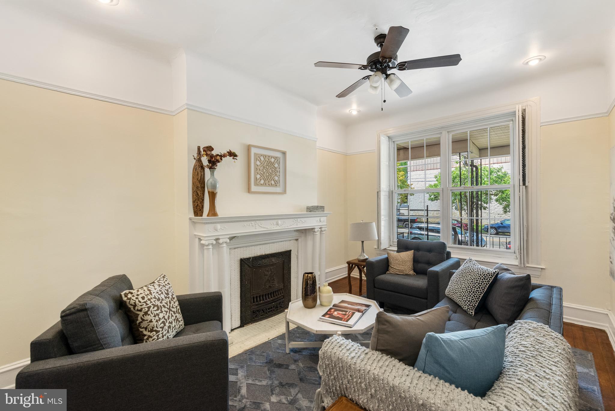 4710 Kingsessing Avenue Philadelphia, PA 19143 - Photo 6 of 30 a living room with furniture and a fireplace