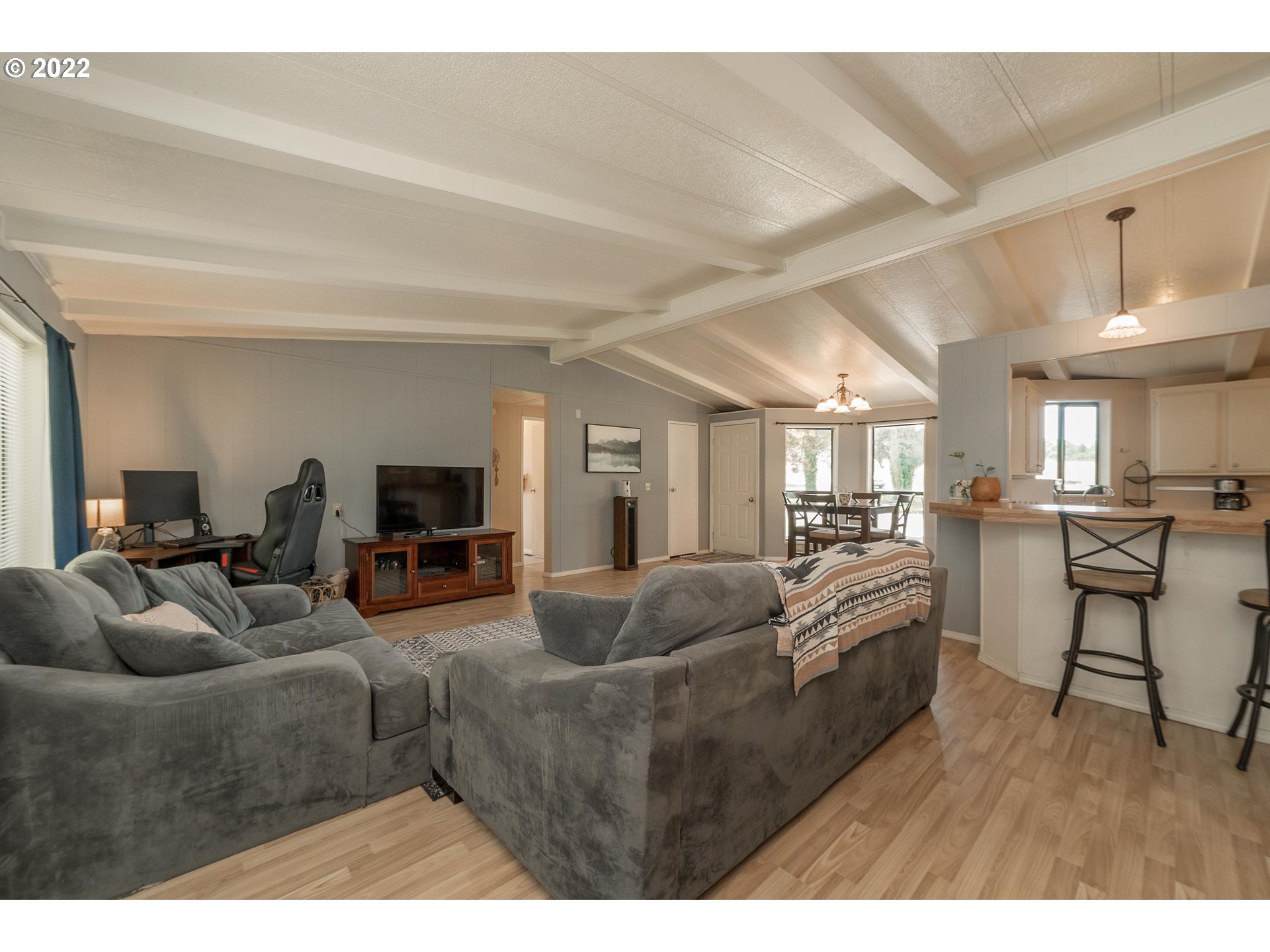 5816 Northwest 304th Street Ridgefield, WA 98642 - Photo 6 of 26 a living room with furniture and a wooden floor