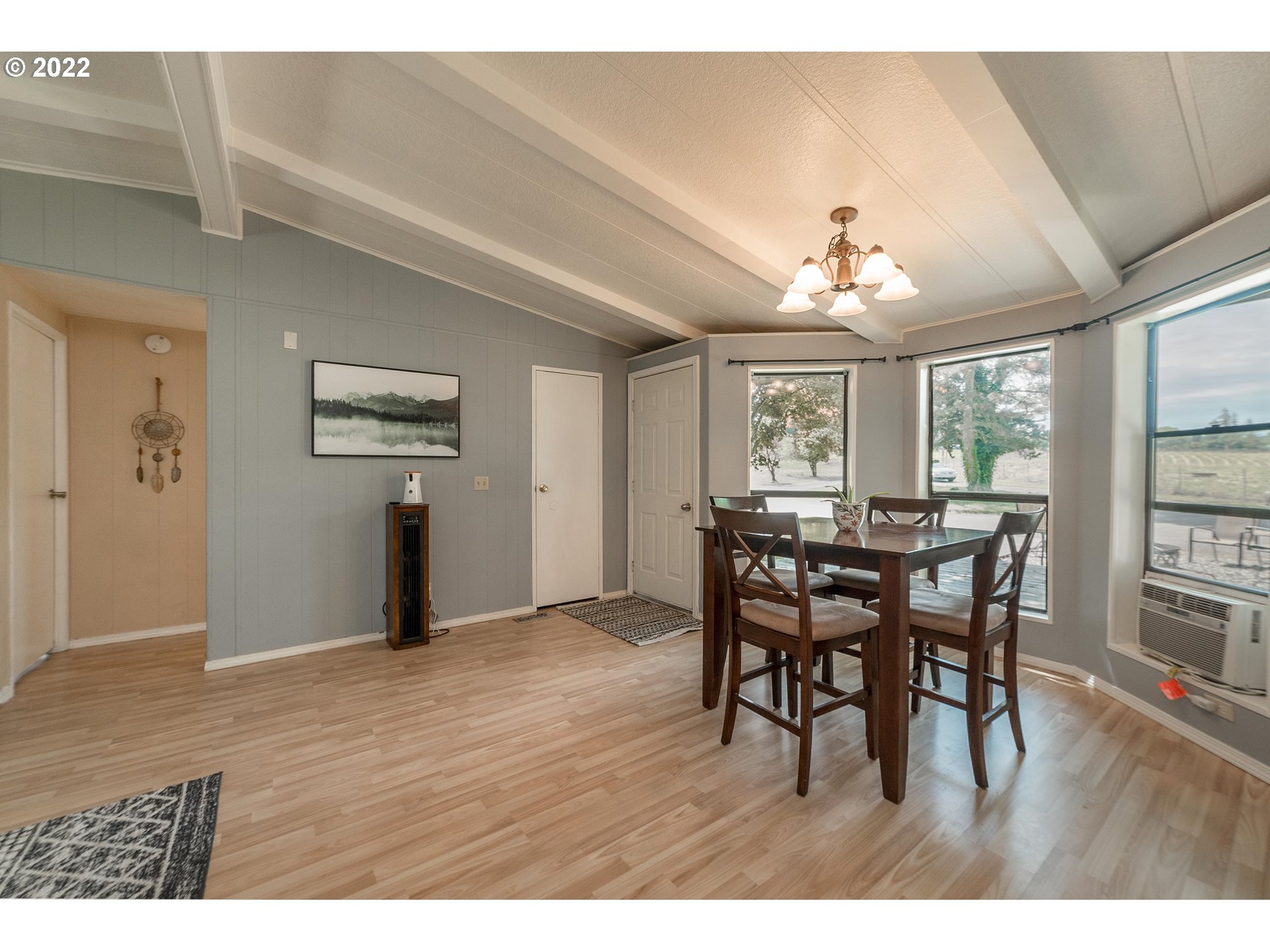 5816 Northwest 304th Street Ridgefield, WA 98642 - Photo 7 of 26 a view of a dining room with furniture window and wooden floor