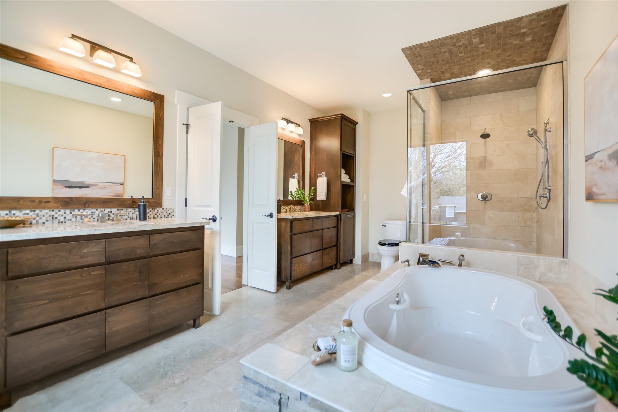 1210 Alguno Road Austin, TX 78757 - Photo 17 of 28 The primary ensuite provides spa-like experience that feels elevated and deeply comfortable.