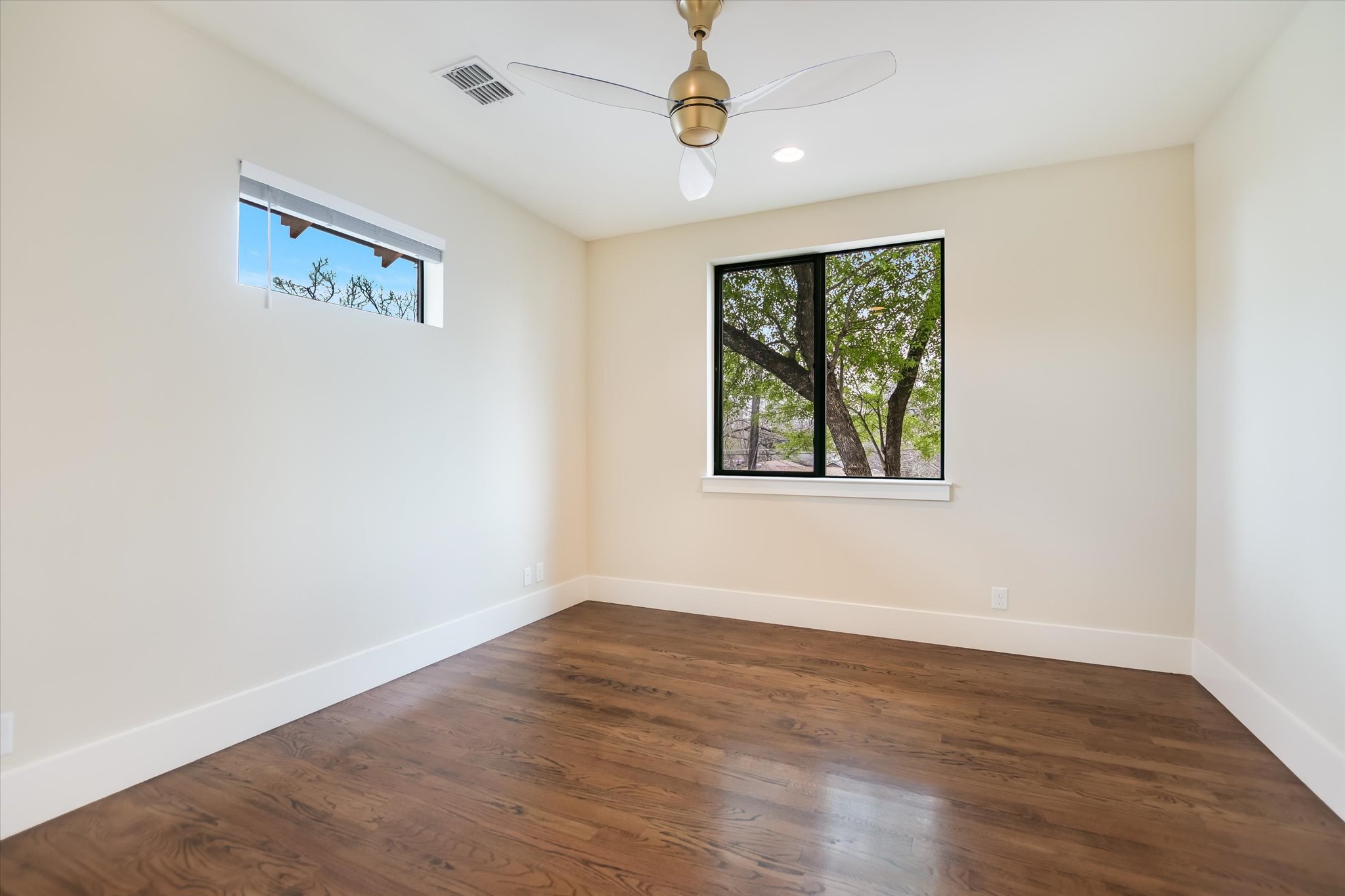 1210 Alguno Road Austin, TX 78757 - Photo 23 of 28 The second of the upstairs secondary rooms has peaceful tree-top views.