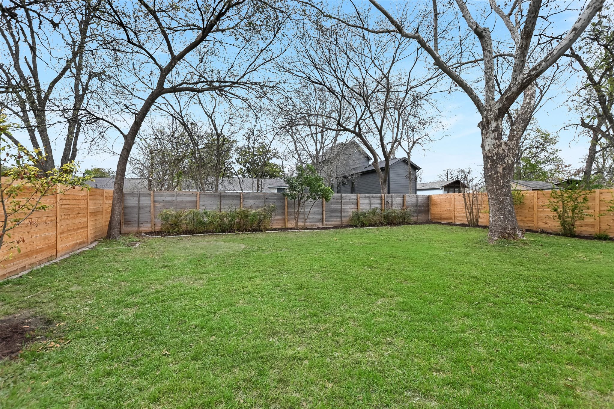 1210 Alguno Road Austin, TX 78757 - Photo 28 of 28 Wide open and easy to enjoy, the backyard offers the kind of usable space that works for everything from playtime to future garden plans.