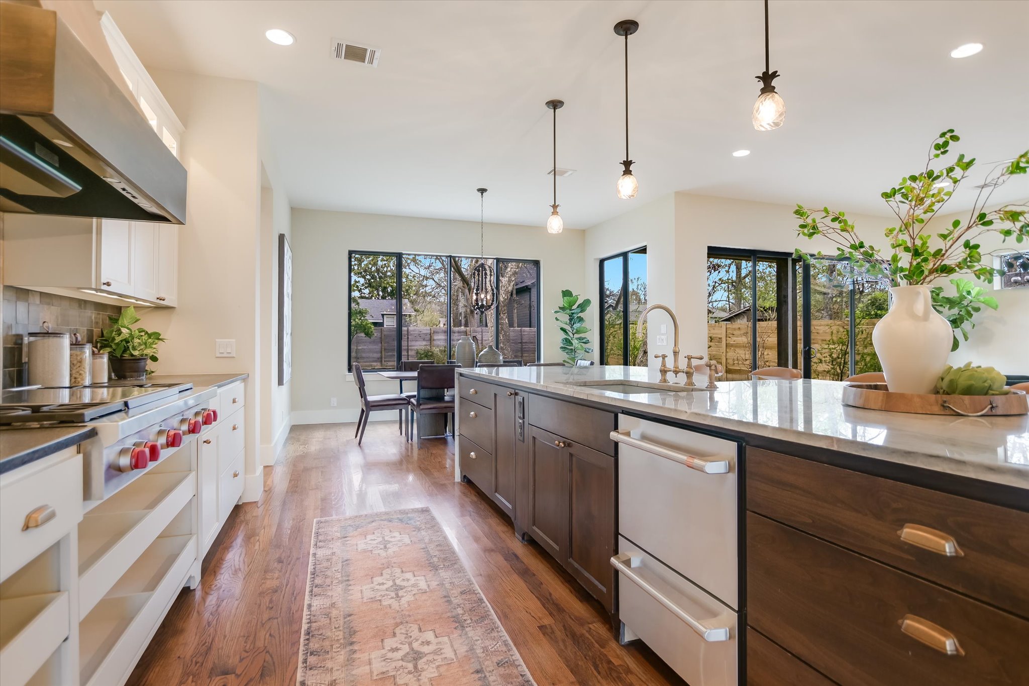 1210 Alguno Road Austin, TX 78757 - Photo 3 of 28 A butler’s pantry, SS appliances, and a coordinating ceiling-mounted hood bring beauty and function together in a kitchen that delivers on both.