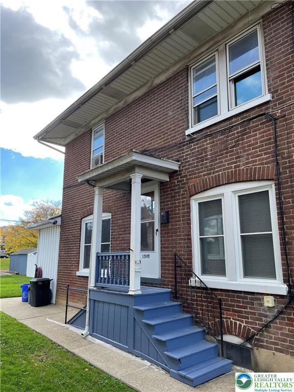 154 West Lincoln Street, Unit 2 Easton, PA 18042 - Photo 2 of 10 a view of a house with wooden deck and furniture