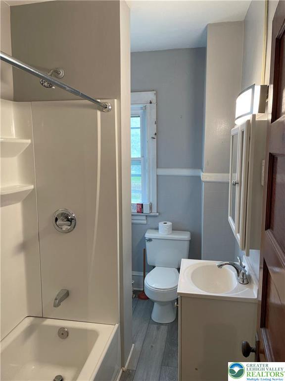 154 West Lincoln Street, Unit 2 Easton, PA 18042 - Photo 9 of 10 a bathroom with a tub a sink and a large mirror