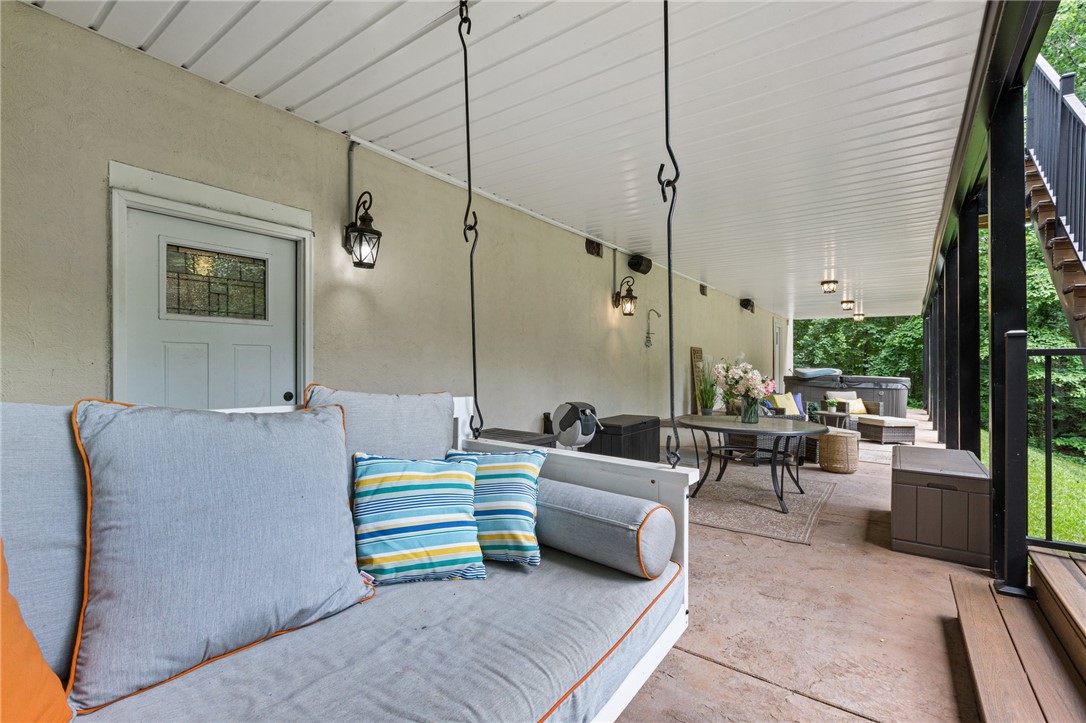 322 Shorecrest Drive Seneca, SC 29672 - Photo 21 of 30 This spacious patio features ample room for relaxation and entertaining, surrounded by lush greenery.
