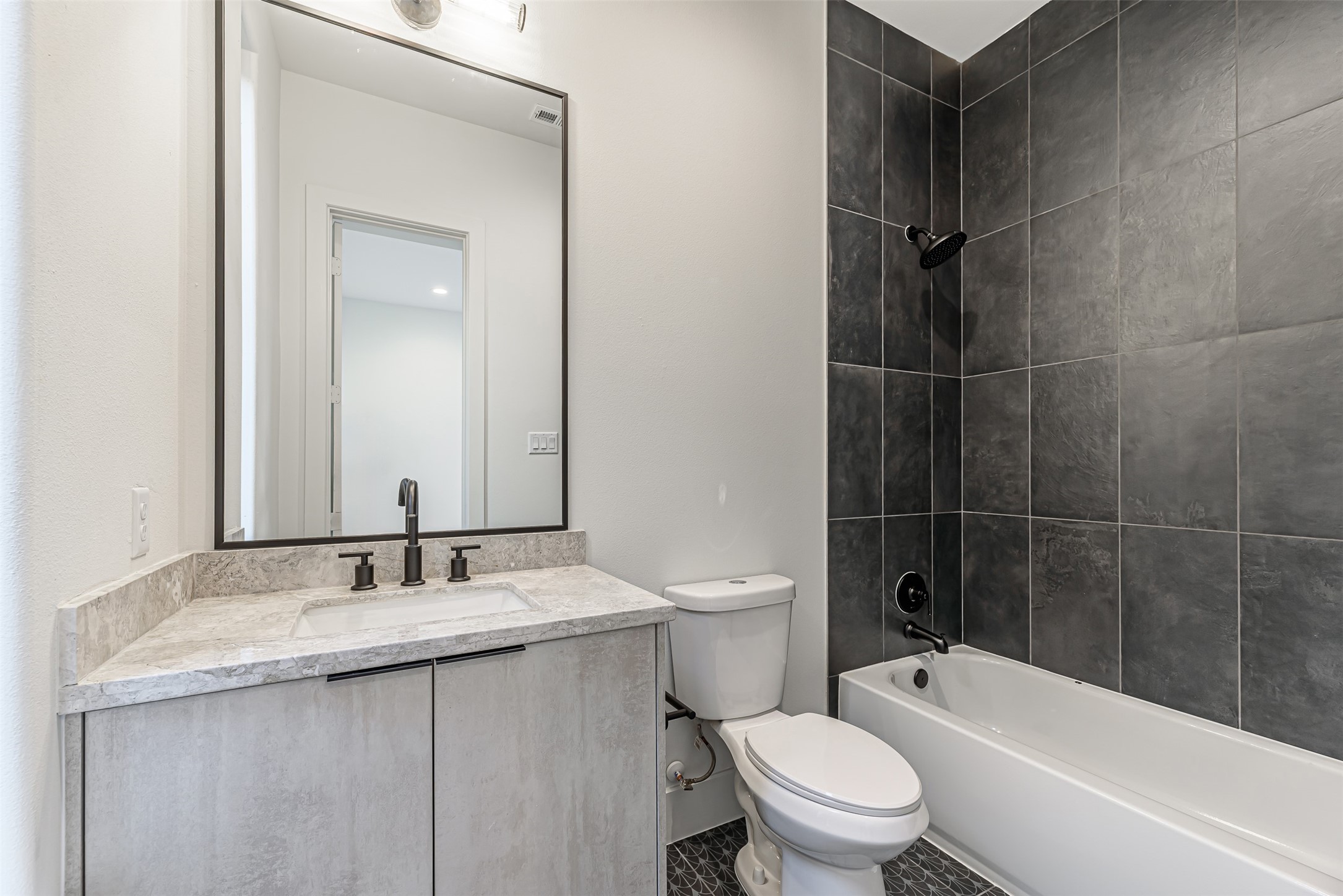 1104 West 9th Street Houston, TX 77007 - Photo 20 of 25 a bathroom with a granite countertop sink toilet and shower