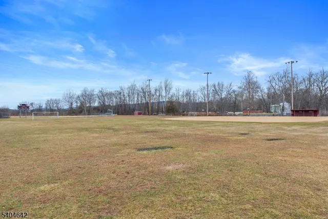 a view of outdoor space with yard and lake view