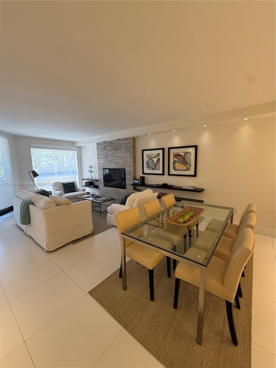 161 Crandon Boulevard, Unit 221 Key Biscayne, FL 33149 - Photo 2 of 13 a living room with furniture and a rug