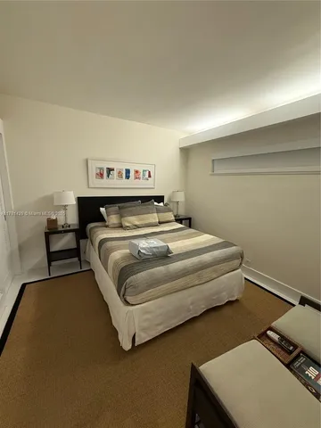 a bedroom with a bed and a dressers