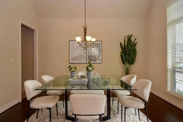 a dining room with furniture and window